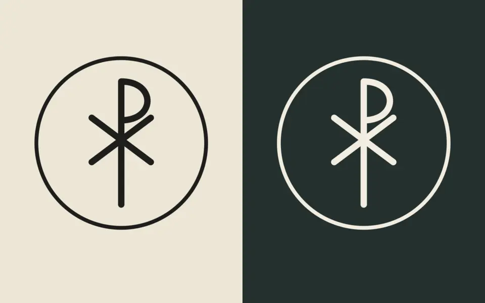 Chi-Rho in a ring design shown twice: dark ink on a cream background and cream ink on a dark green background