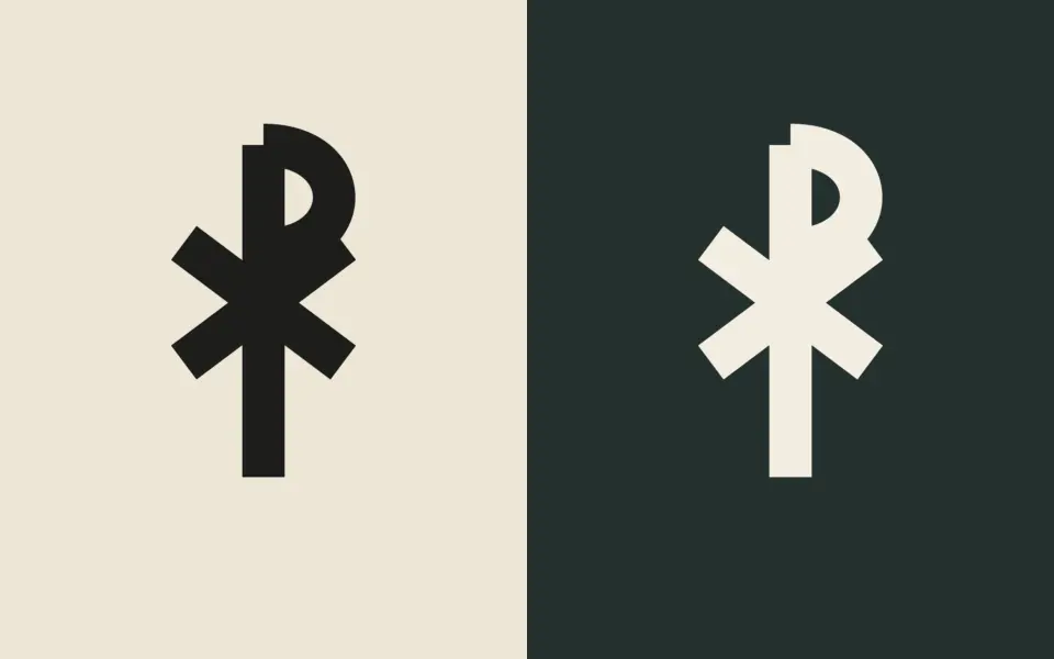 Bold Chi-Rho design shown twice: dark ink on a cream background and cream ink on a dark green background